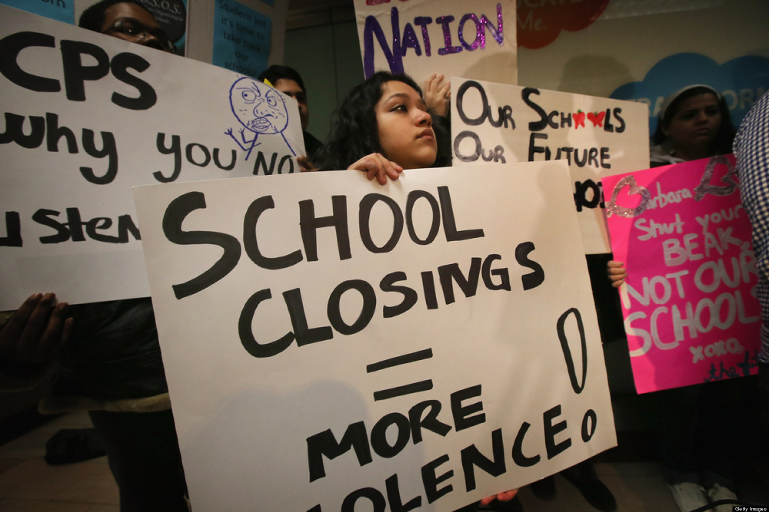 CHICAGO, IL - MARCH 25:  Students protest outside the Chicago Public Schools headquarters against the city's plan to close more than 50 elementary schools on March 25, 2013 in Chicago, Illinois. Last week the city announced the plan claiming it was necessary to rein in a looming $1 billion budget deficit. The closings would shift about 30,000 students to new schools and leave more than 1,000 teachers with uncertain futures.  (Photo by Scott Olson/Getty Images)