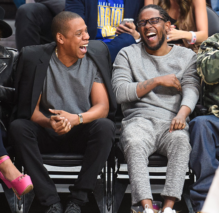 ><figcaption>Photo Credit: Noel Vasquez</figcaption></figure>
<p>You ever see somebody in the distance laughing with somebody els and you start wondering what are the so happy about. I’m sure we have all done it at least once or twice. This past Saturday, February 20, Kendrick Lamar and Jay-Z attended a basketball game between the <strong>Golden State Warriors</strong> and the LA Lakers at the Staples Center in Los Angeles, California. Lamar and Jay were photographed laughing it up about something. <strong>Queen Bey</strong> was in the house too but on this particular photo she wasn’t included in the party. While you are at it, check out those classic <strong>Reebok Classic Leather</strong> sneakers Kendrick is sportin’ at the game.</p>

    <div class=